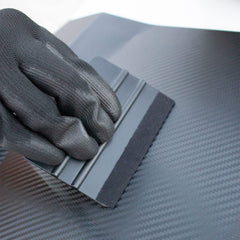 Spanno wrapping knife provides safe blade for neat cuts.
