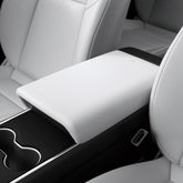 Spigen center console armrest cover on Tesla Model Y front view protects interior surfaces.