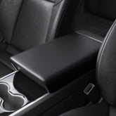 Spigen center console armrest cover on Tesla Model Y closeup showing durable TPE surface