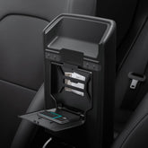Spigen One-Tap Hidden Storage Box for Tesla Model Y Juniper installs under the armrest for secure storage.