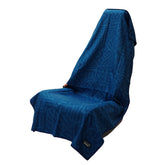 Sprints athletic running towel full-sized draped over car seat for sweat absorption.