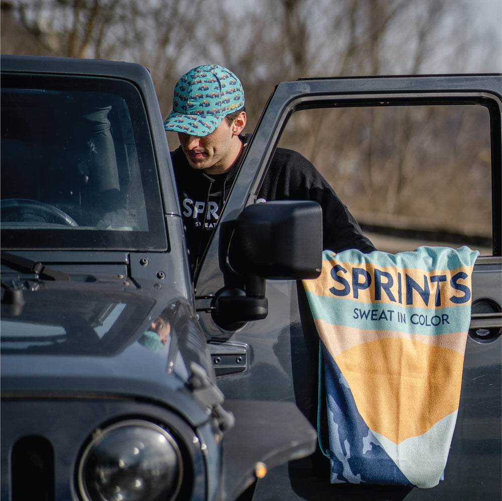 Sprints athletic running towel sasquatch edition branding on trail gear.