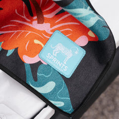 Sprints towel on beach chair illustrates versatile outdoor use.
