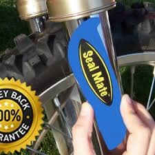 Squatch Racing Seal Mate blue 2-pack in action on a bike for on-bike maintenance.