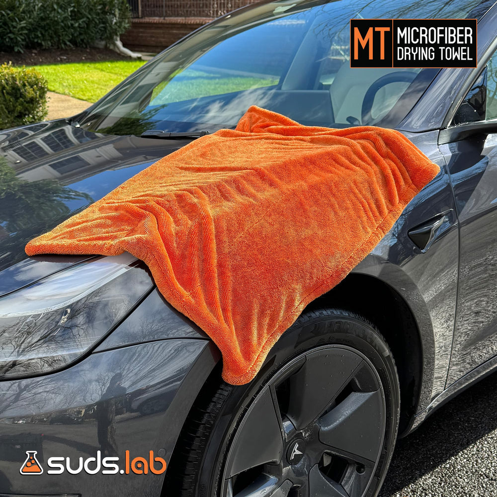 Suds Lab towel on a painted surface removing water without scratches