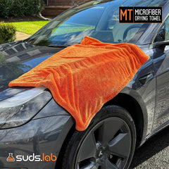Suds Lab towel on a painted surface removing water without scratches