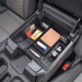 TACOBRO center console tray installed in front bucket seats, keeps essentials within reach.