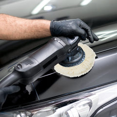 Tallew wool buffing pad on car body for oxidized paint removal