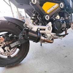 TBVECHI carbon fiber muffler packaging included with the product box.