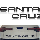 Texflic tailgate letters on Hyundai Santa Cruz, matte black emblem adds rugged style.