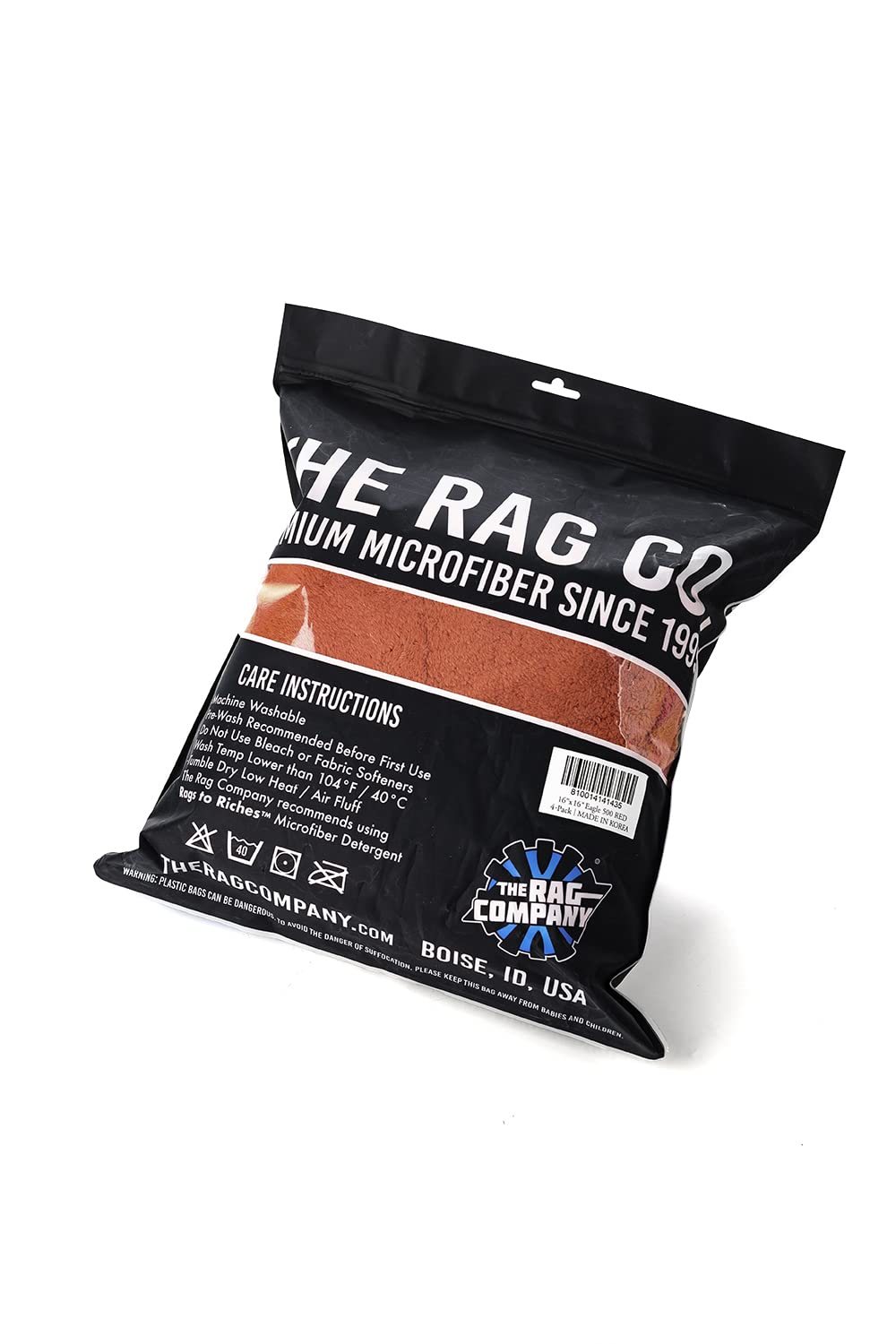 The Rag Company Eagle Edgeless 500 red towels during a water-absorption test.