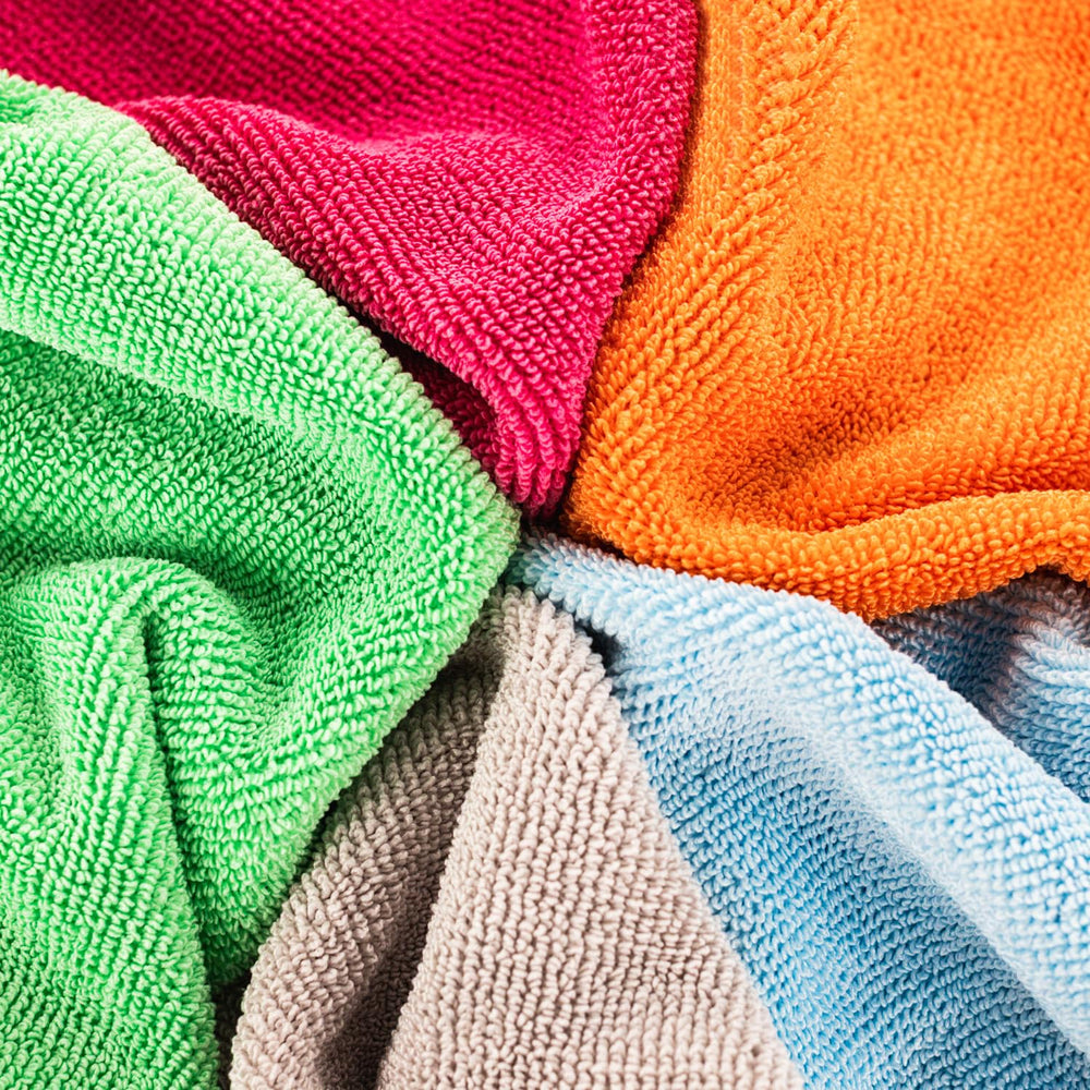 The Rag Company FTW towel for car detailing buffs glass and residues cleanly.
