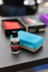 The Rag Company towels used to buff and level coatings on a car surface