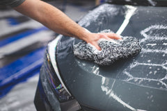 The Rag Company Cyclone Ultra Wash Mitt in use on car panel for safe washing