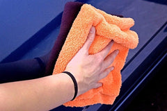 Orange Eagle Edgeless towel shown among color options for detailing.