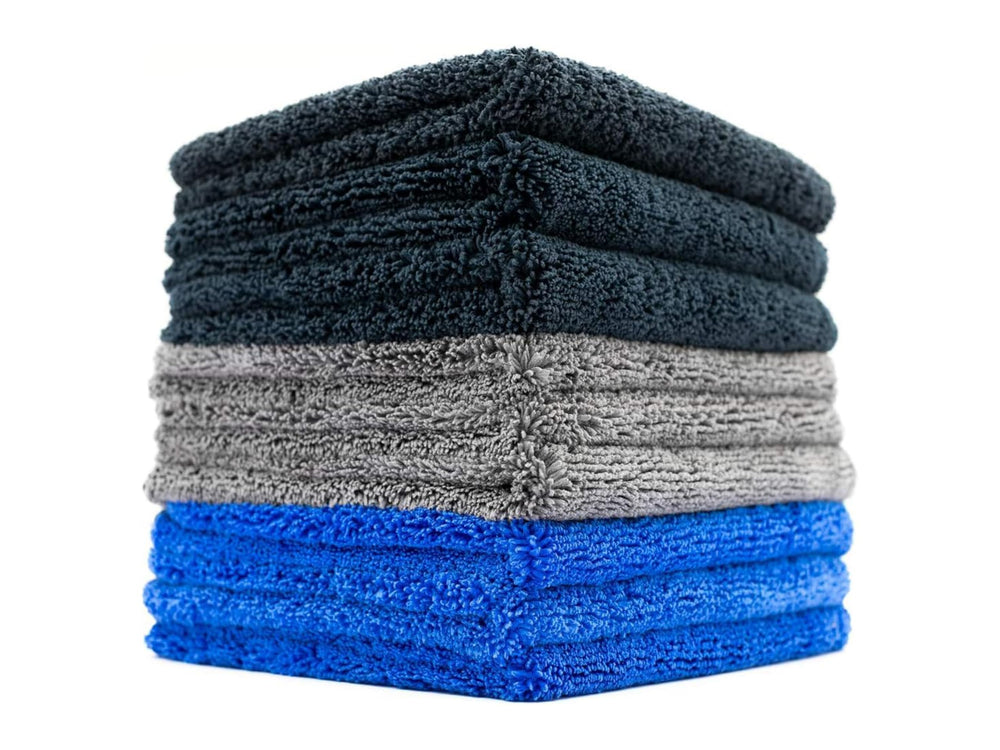 The Rag Company Spectrum 420 Dark Pack towels stacked for car detailing and drying.