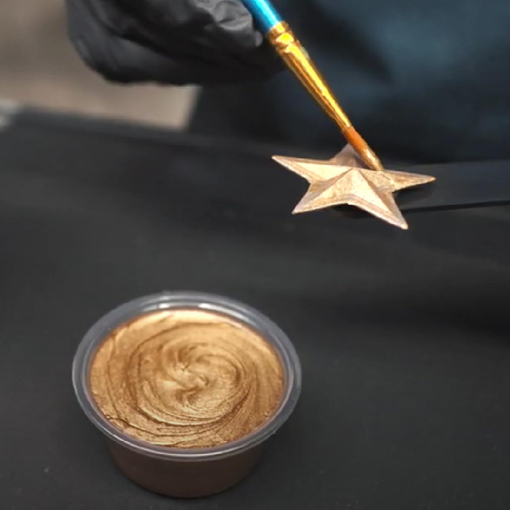 TotalBoat TotalGold brush stroke on wood demonstrates smooth satin gold.