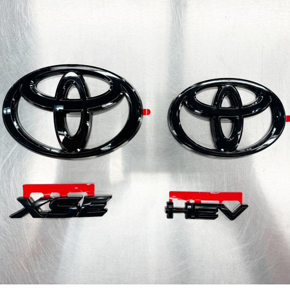 Toyota PT948-03256-02 gloss black emblem overlay on the front badge, adds bold modern style.