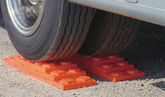 Tri-Lynx Lynx Levelers under single wheel for stabilized parking.