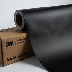 TRUE LINE Automotive 3M 2080 matte black wrap finish on a door panel for a stealthy, durable look.