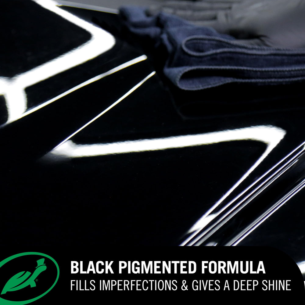 Turtle Wax Hybrid Solutions swirl removal demonstrates smooth black finish.