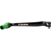 TUSK folding shift lever with black/green tip for Kawasaki KLX300 enhances durability and control.