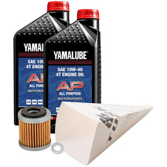 Tusk oil change kit with Yamalube 10W-40 bottle pouring for quick maintenance.