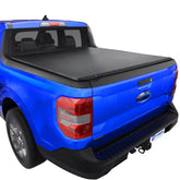 Tyger Auto T3 soft tri-fold cover closed over Maverick bed protecting cargo.