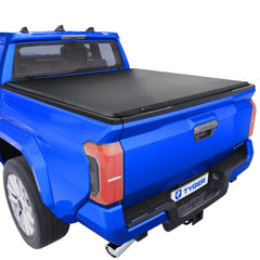 Tyger Auto T3 cover front view on Toyota Tacoma showing deck rail compatibility for secure cargo.