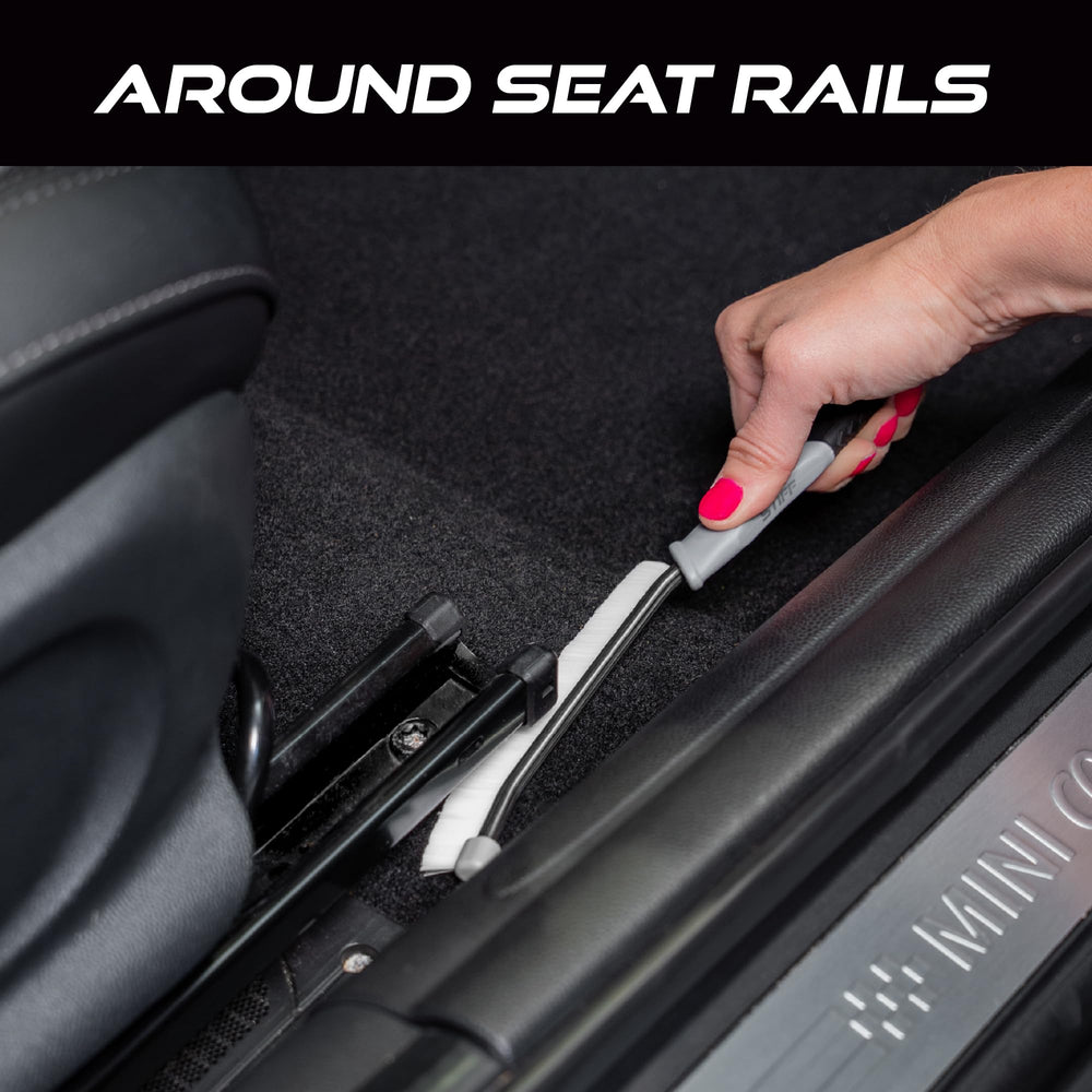 VIKING car detailing brush shown cleaning interior crevices with ease.