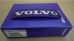 Volvo Genuine grille badge install guide image highlights easy application.