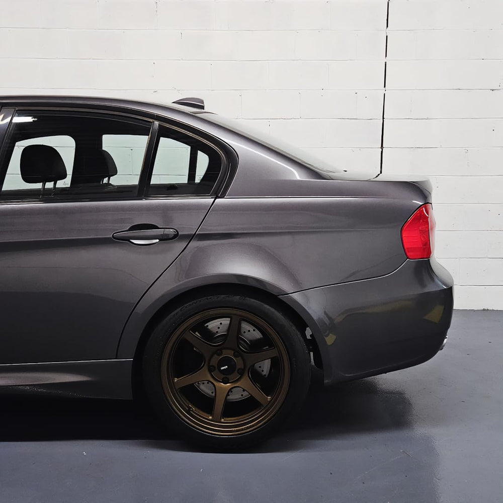 VViViD Charcoal Grey wrap applied to a car exterior for a refined look.
