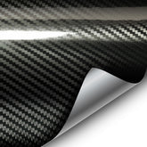 VVIVID epoxy high gloss black carbon wrap on car exterior showing showroom finish