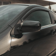 VViViD gloss black vinyl wrap applied on car body showing showroom-grade finish