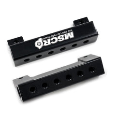 WnSEu vacuum block with plugs included to seal unused ports.