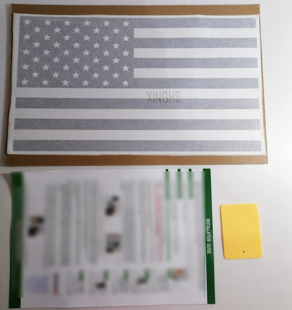 Xinghe privacy-protecting flag decal viewed from behind the truck