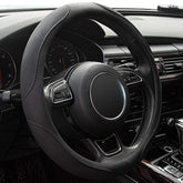 Xizopucy steering wheel cover on a 14-15 inch wheel with microfiber leather for grip.