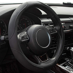 Xizopucy steering wheel cover on a 14-15 inch wheel with microfiber leather for grip.