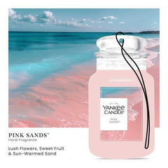Yankee Candle Car Jar Pink Sands hanging from the rearview mirror for easy refreshment