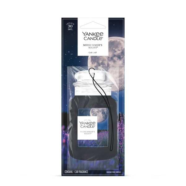 Yankee Candle Car Jar Midsummers Night hanging from rearview mirror for on-the-go scent.