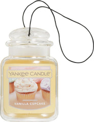 Yankee Candle Car Jar Ultimate Vanilla Cupcake hanging in car boosts aroma