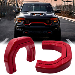 Yinnianets tow hook cover on RAM 1500 front view in red silicone rubber.