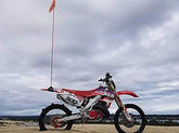 ZENXTENinc uniWhip 3.0 MX mount on dune bike keeps flags secure for off-road visibility.