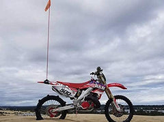 ZENXTENinc uniWhip 3.0 MX mount on dune bike keeps flags secure for off-road visibility.