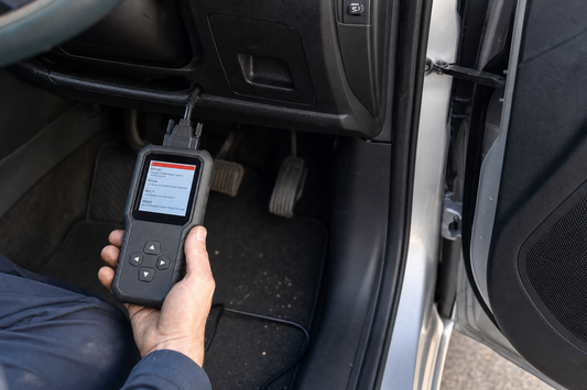 Reading engine fault codes with an OBD2 scanner plugged into a car's diagnostic port, PlentyTorque UK guide