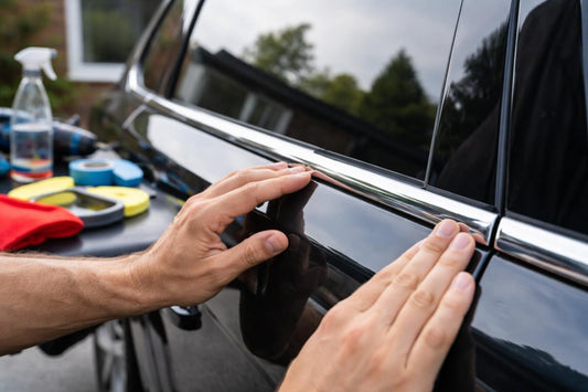 Hands aligning exterior accessory trim for a secure fit