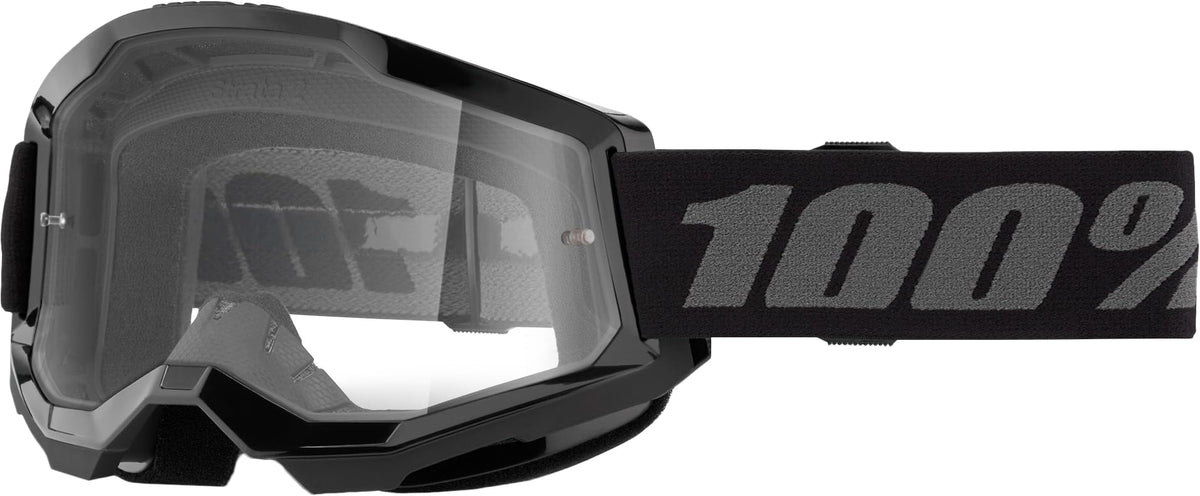 100% Strata 2 goggle with black frame and clear lens, ideal for trail rides and helmet compatibility.