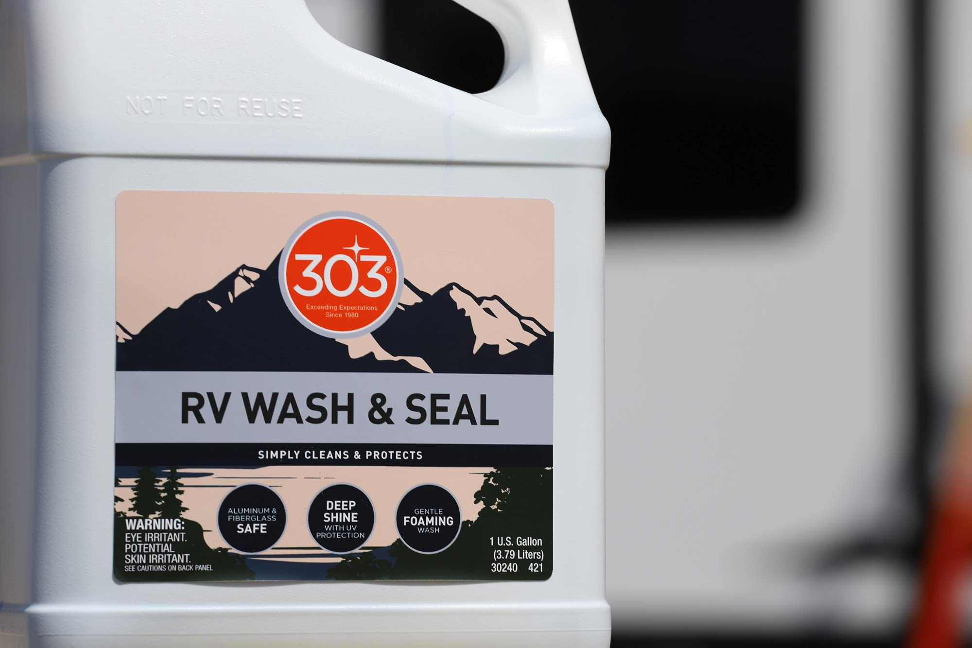 303 Products RV Wash & Seal bottle shown at an angle for pouring