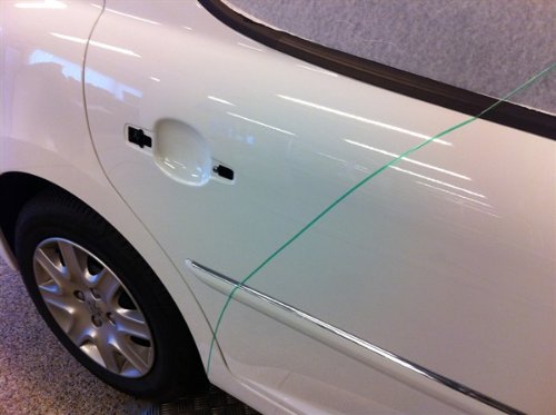 Door handle detailing with 3M finish line tape during wrap work