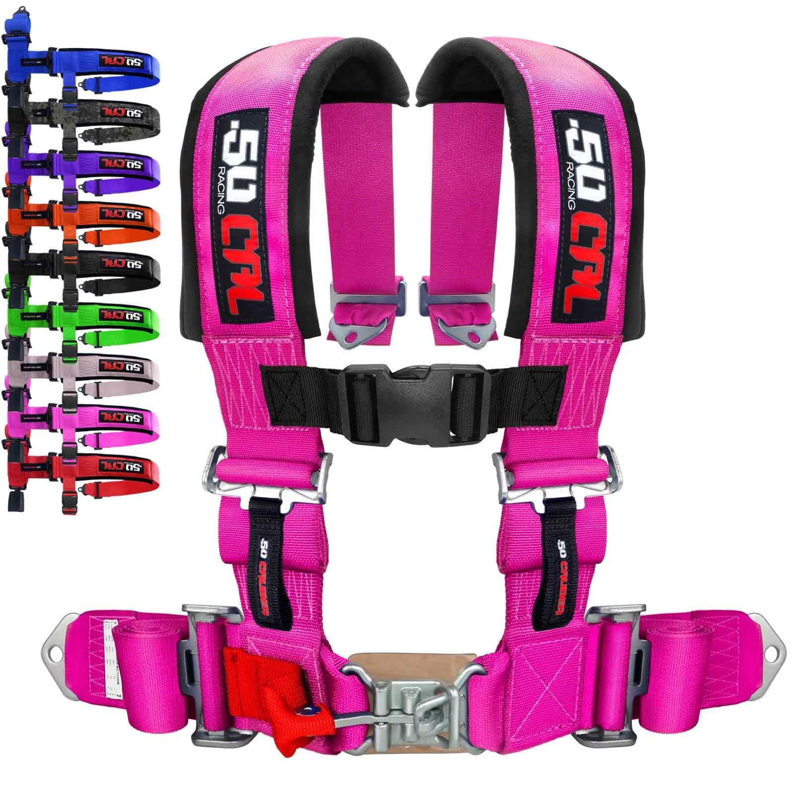 50 Caliber Racing pink 4 Point Harness mounted on bucket seat for secure off-road use.